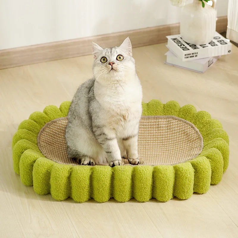 Green oval-shaped cat scratch pad bowl with sisal scratching surface, functioning as a cat bed.