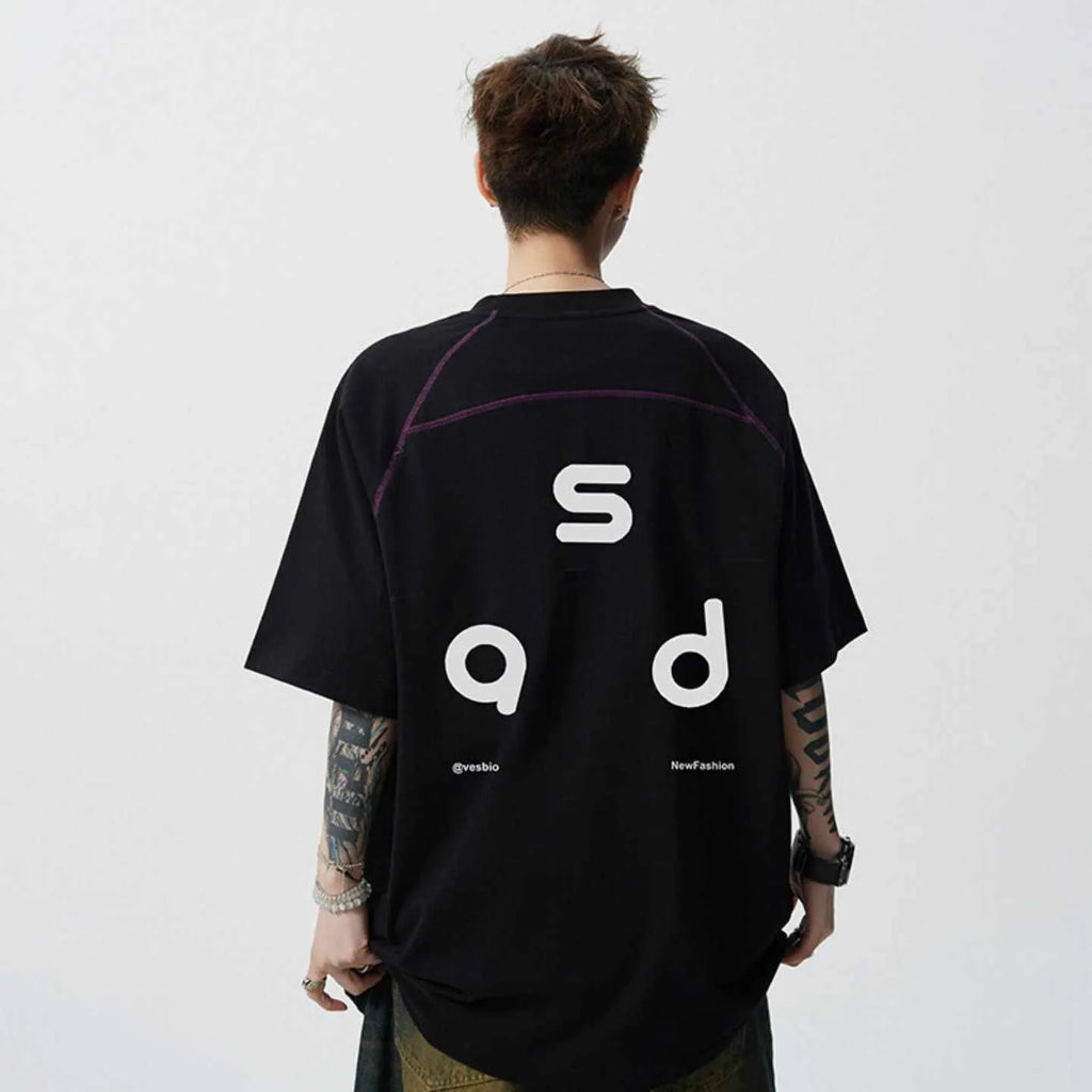 Loose fit black cotton t-shirt with white letter print, short sleeves, and round neck.