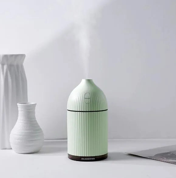 White ultrasonic aroma diffuser humidifier with LED light, measuring 80mm wide and 155mm tall.