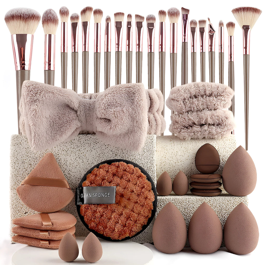 Beauty tool set with multiple pieces in brown, pink and purple colours for face wash and makeup application