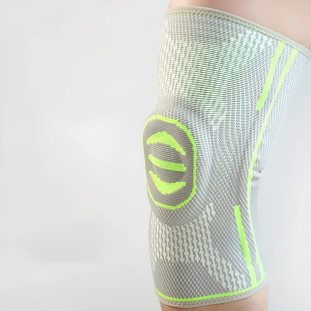 A pair of cotton mountaineering knee pads in blue, shown on a knee.