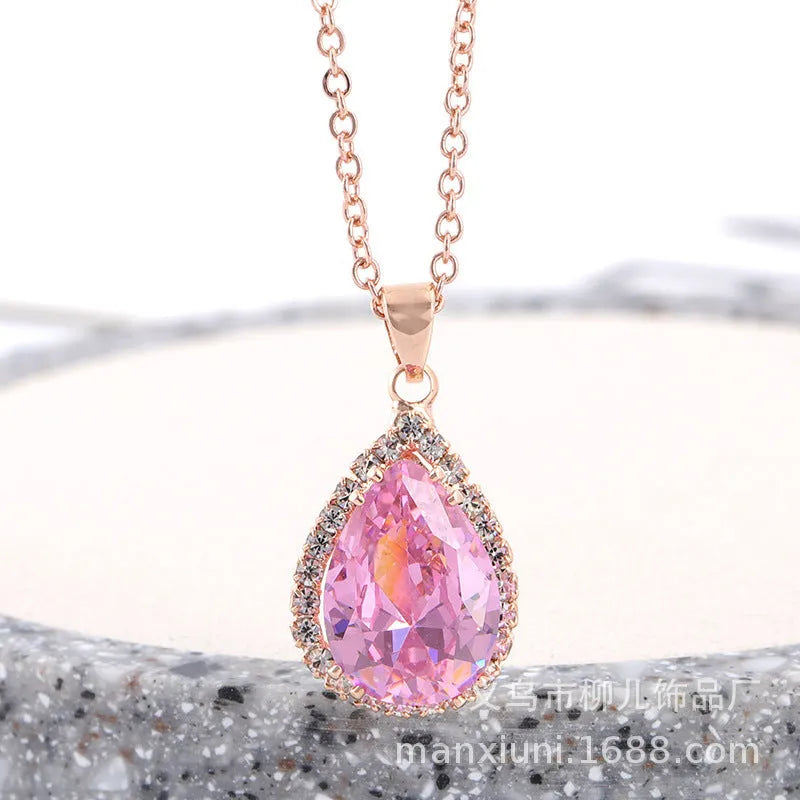 Pink rose gold drop shape rhinestone necklace with geometric design on alloy chain