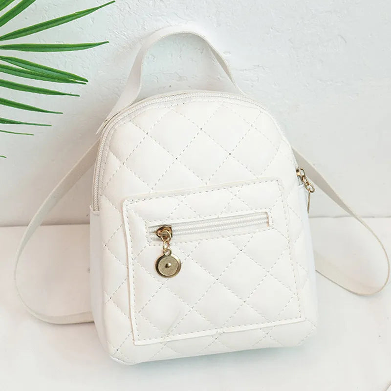 Hardback white PU girls backpack with embroidery, showing front sandwich pocket and soft carry handle.