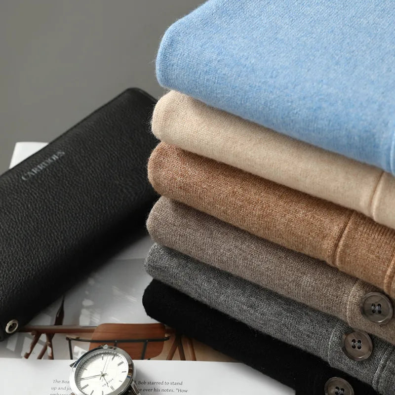 Man wearing a beige Andy velvet V-neck knitted cardigan coat with long sleeves.