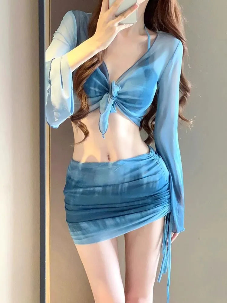Blue women's high-waist bikini set with shirt, bra, underwear, and skirt on a mannequin.