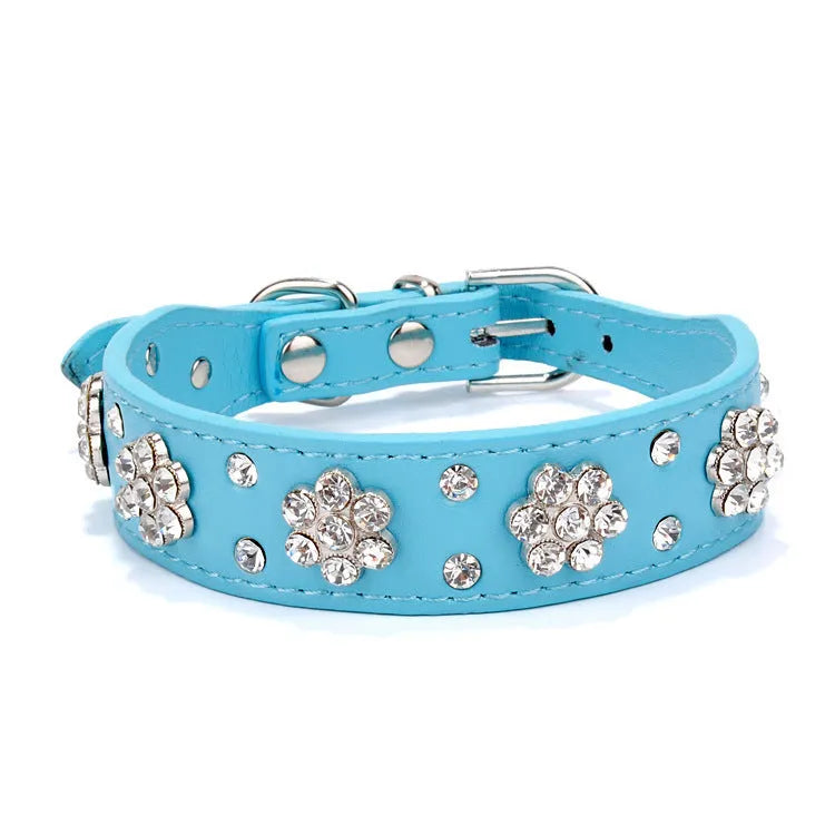 Black PU leather dog collar with silver rhinestone flower pattern and metal D-ring for small dogs.