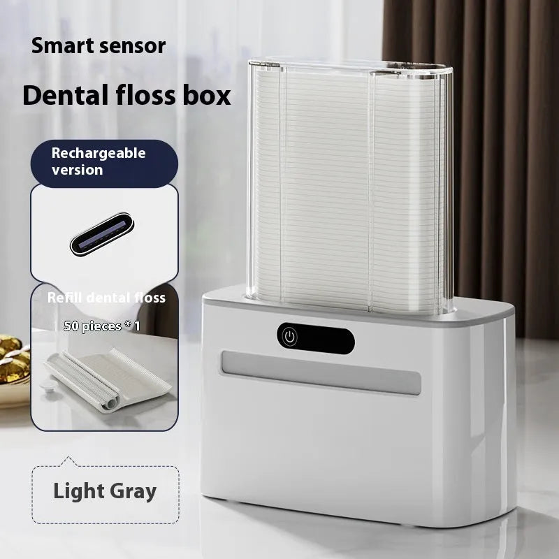 Dark grey automatic electric dental floss box with rechargeable battery and floss refills
