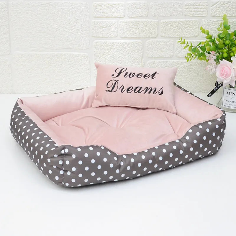 Small polka dot print square dog bed with a matching square pillow inside, shown in grey colour.
