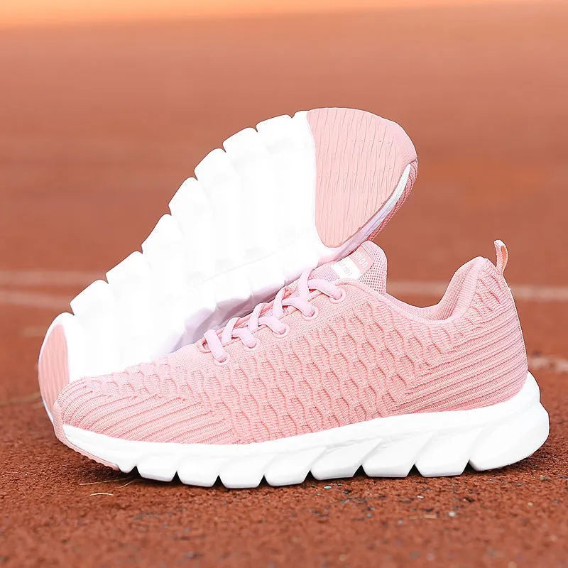 Women's running shoes with mesh upper in black, pink, or white colour options