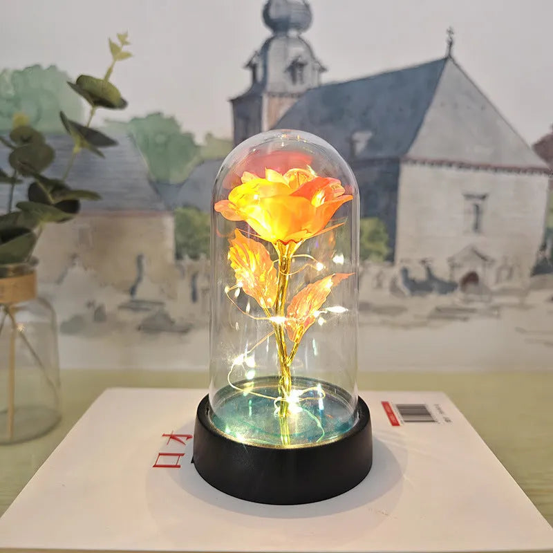 Glass cover small night lamp with plastic flowers in 15cm tall design with black base
