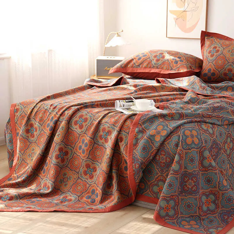 Cotton gauze bed blanket three-piece set with floral plant pattern showing blanket and two pillowcases
