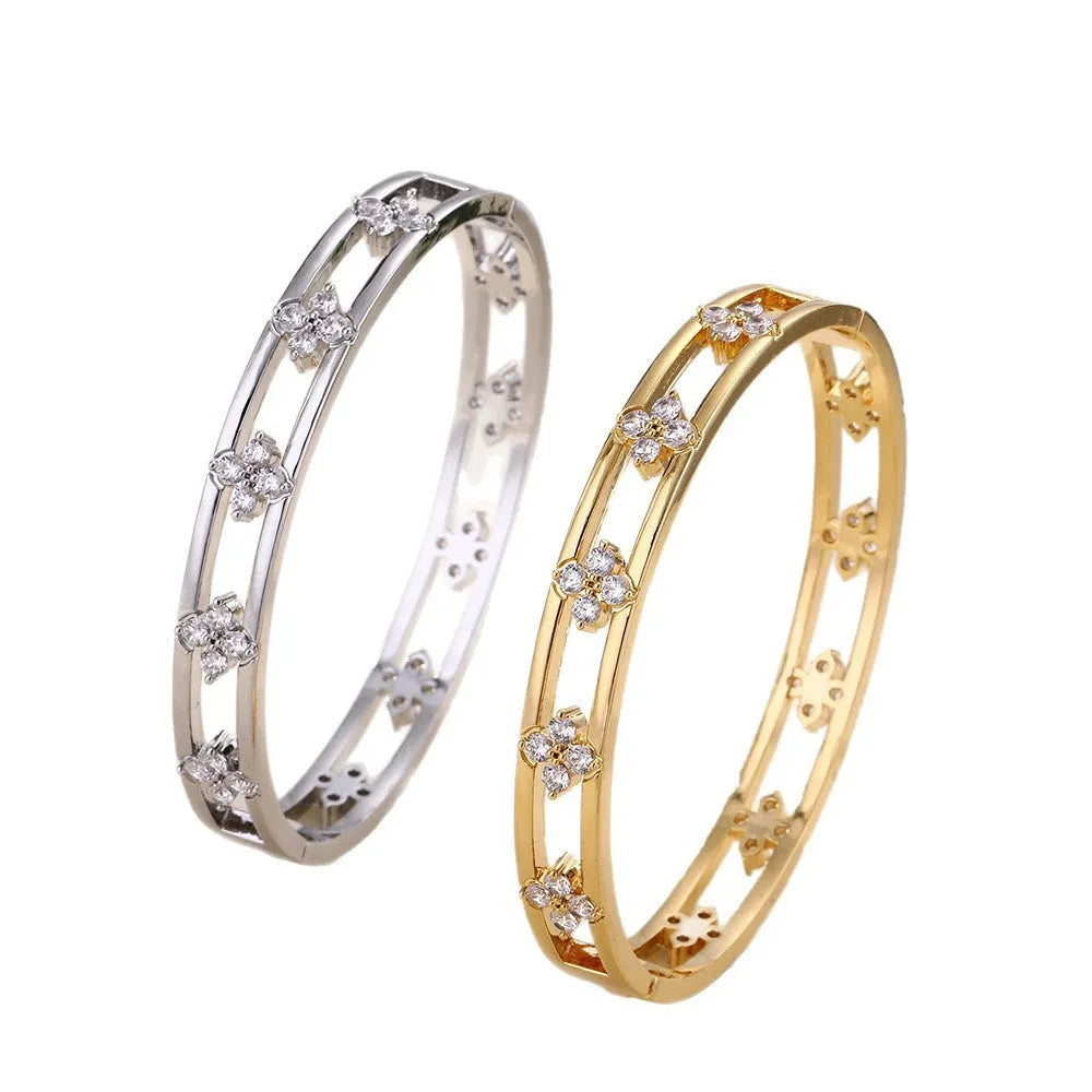 Gold and silver women's bracelets with hollow design and four-leaf clover zircon charms.
