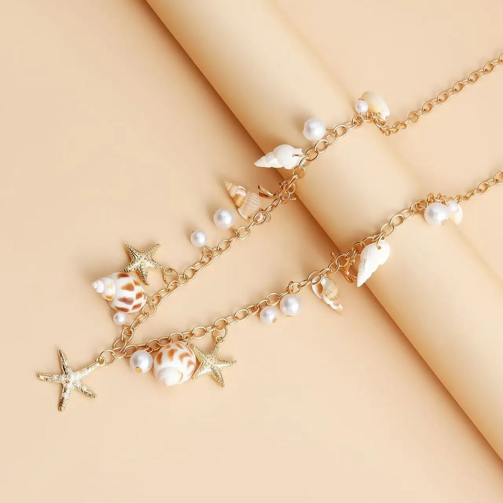 Women's alloy waist chain and matching bracelet with star shell design for beach wear