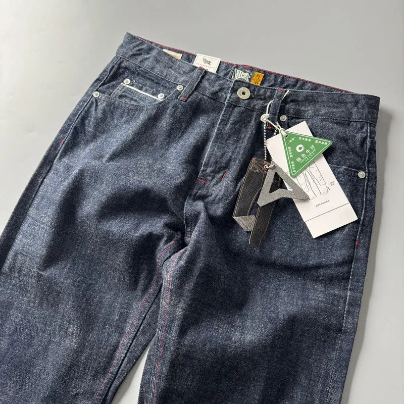 Men's primary colour straight leg jeans in American retro style laid flat, showing the mid waist and full-length leg.