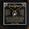 Silver and gold hollow heart necklace pendant presented on a card inside an open gift box.