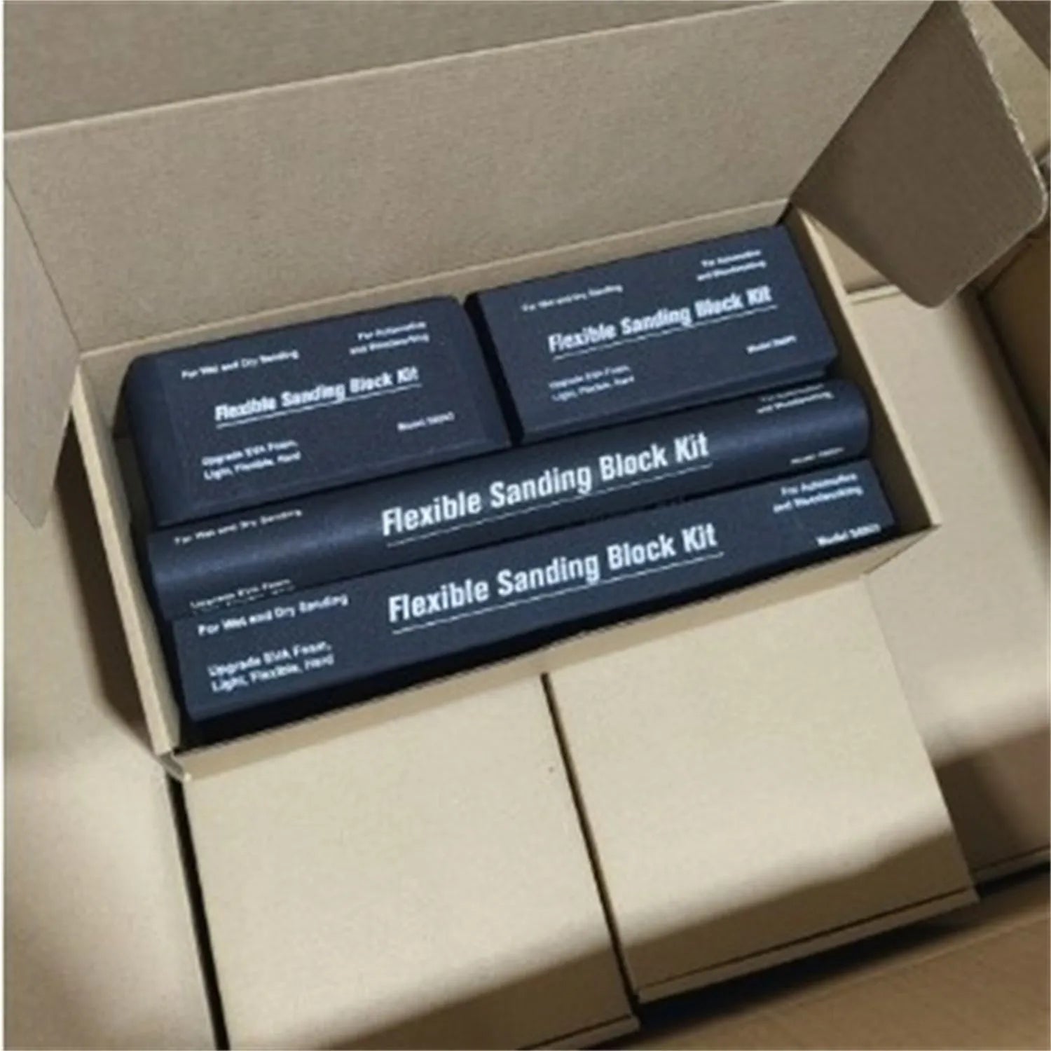 Seven black frosted building blocks with metal construction arranged as a set
