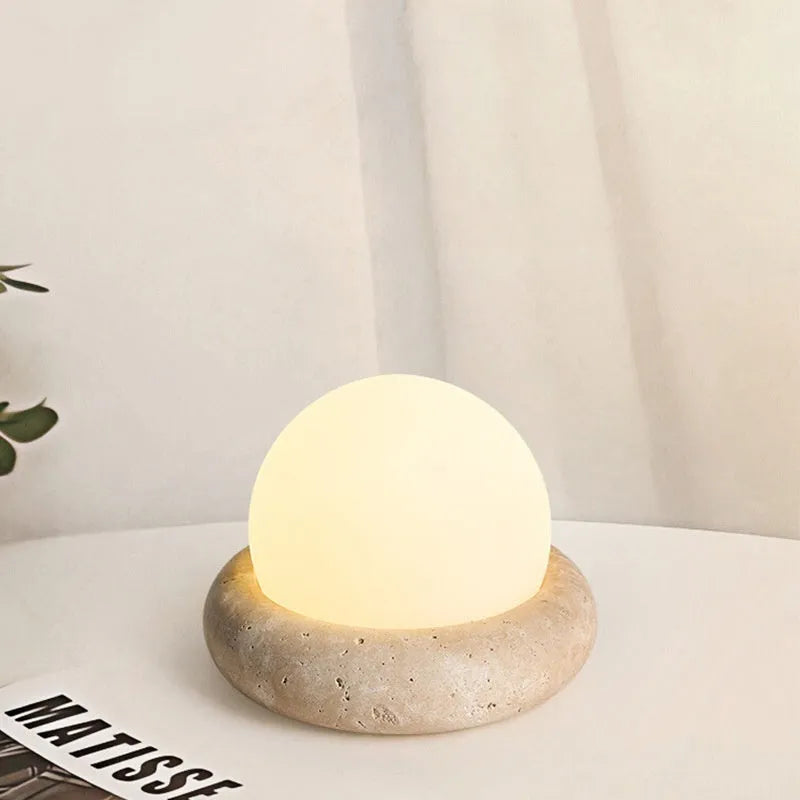 Cream modern bedside night light with remote control on wooden table