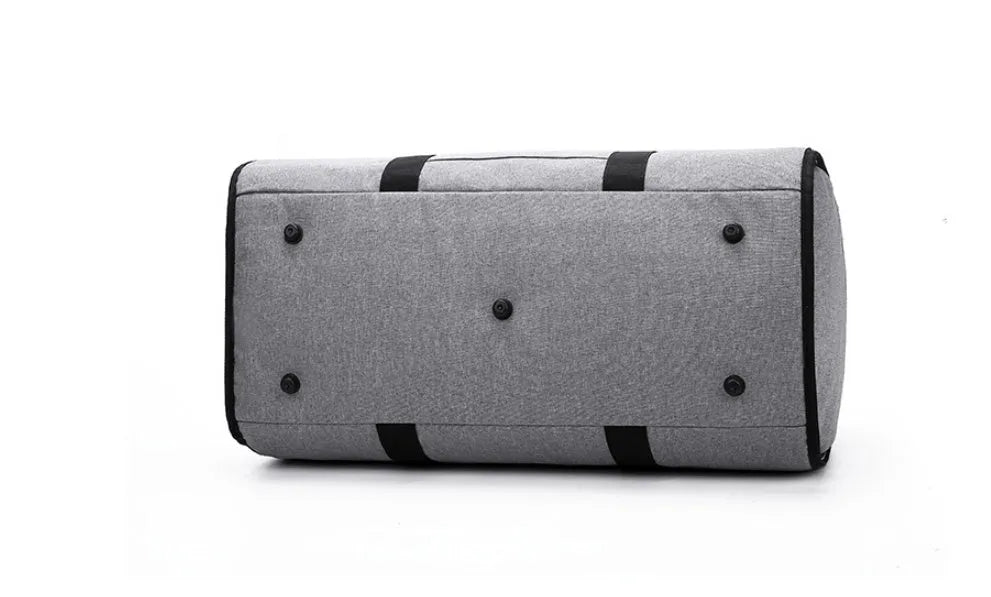 Medium sized cylindrical travel bag in black, made from oxford cloth with a top zipper.
