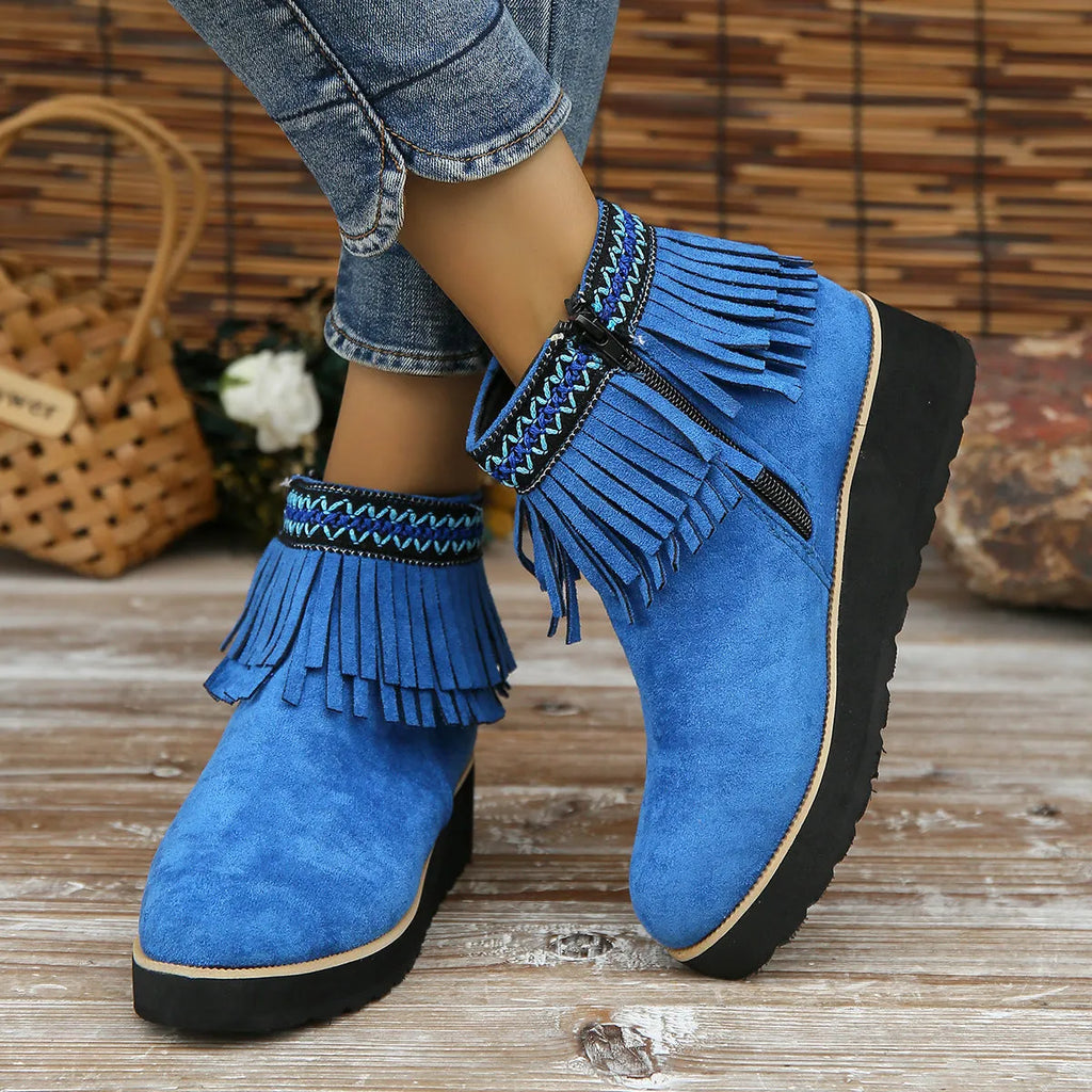 Women's dark brown suede wedge ankle boots with a side zip and decorative tassel.