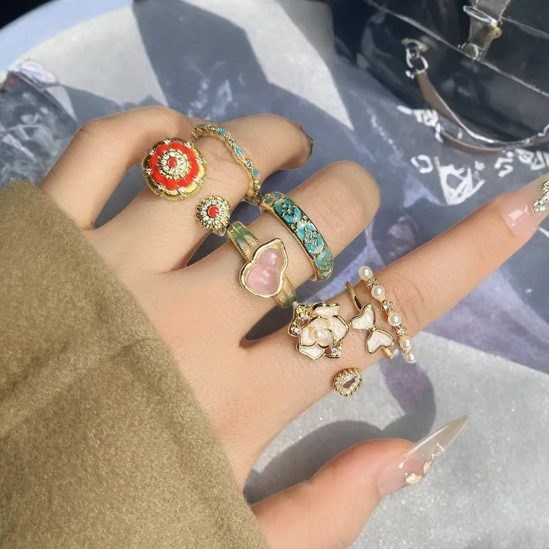 Adjustable copper ring with vintage gourd, floral, and bow design in New Chinese style, set with zircon stones.