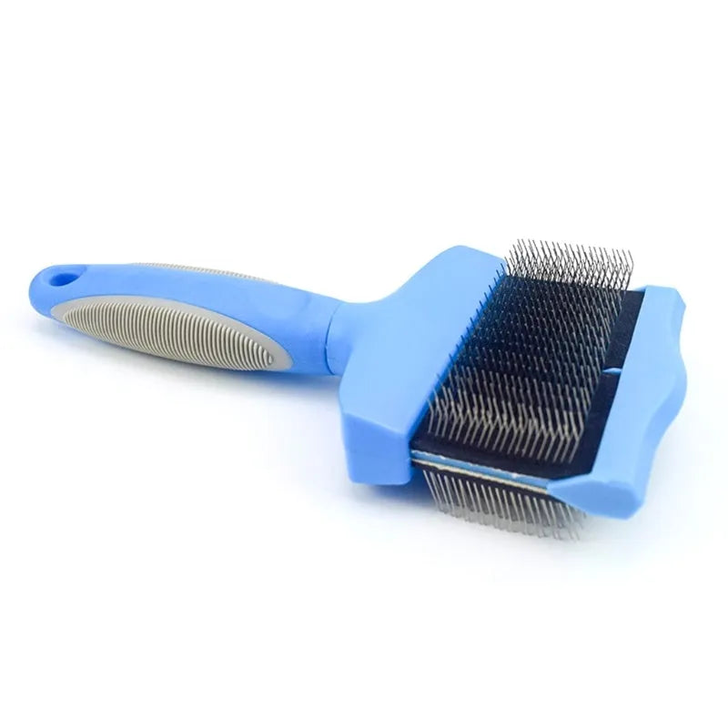 Blue double-sided dog grooming brush with stainless steel pins and ergonomic non-slip handle on a white background.