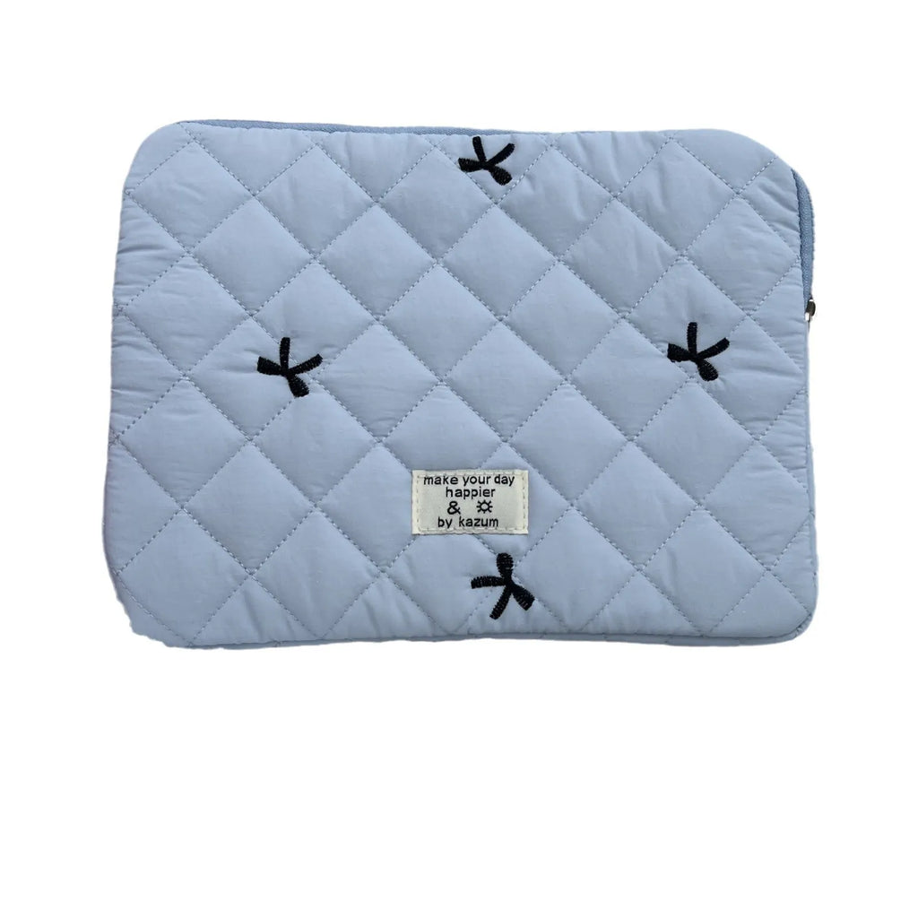White nylon laptop bag with embroidered rhombus pattern and fabric bow, shown alongside black, light blue, and light pink colour options.