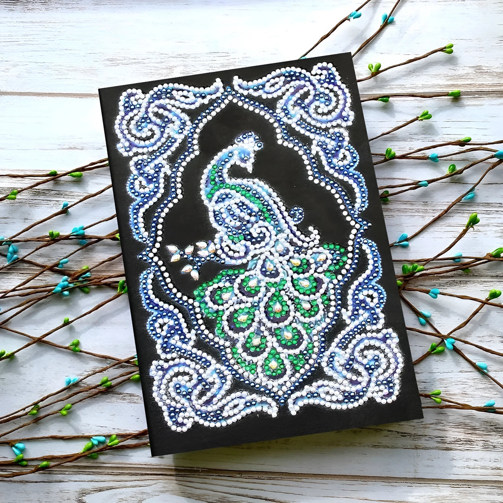 Black A5 diamond painting notebook with peacock design showing shaped and bright drills