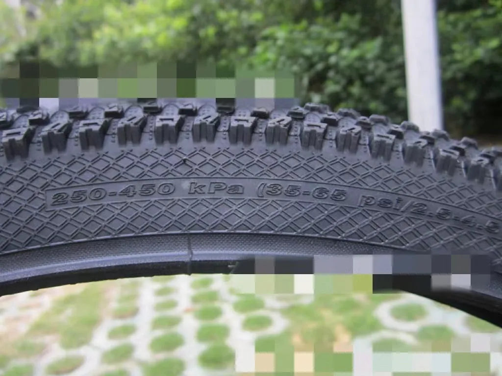 Ultralight puncture-resistant mountain bike tyre shown in black with white label option, for 26, 27.5 and 29-inch wheels.