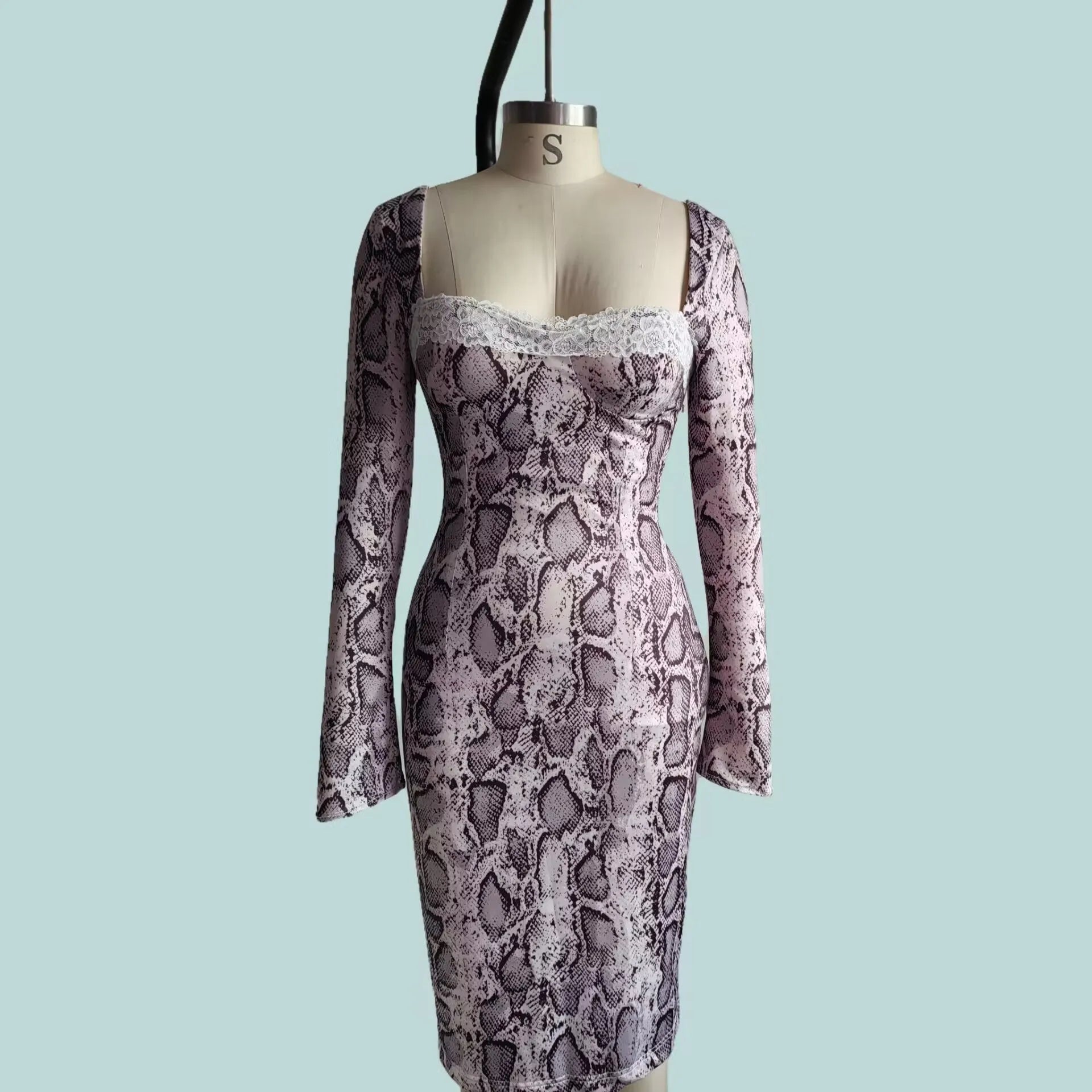 Grey slim fit lace dress with 3D digital print pattern and long sleeves on mannequin