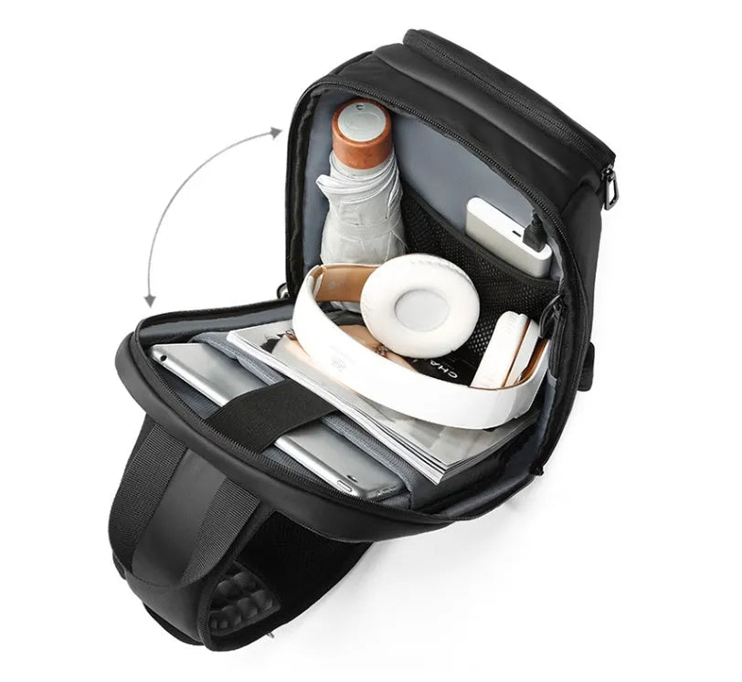 Black outdoor shoulder bag with air cushion strap showing internal laptop and organiser pockets