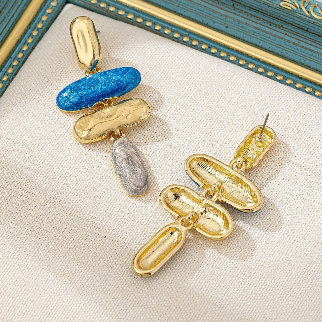 A pair of simple geometric stud earrings with a multicolour electroplated finish on a zinc alloy base.