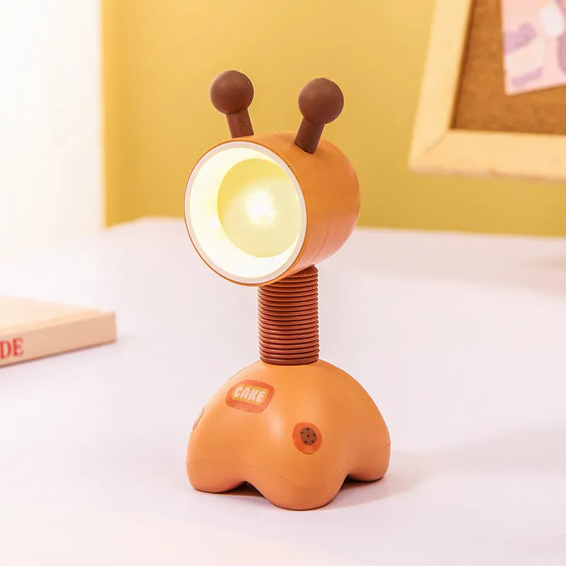 DIY magnetic cartoon small night lamp with multi-angle adjustable lighting on desktop
