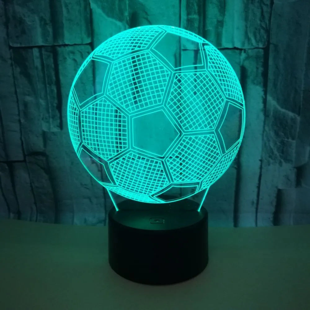 3D football-shaped night light showing multicolour illumination on acrylic surface