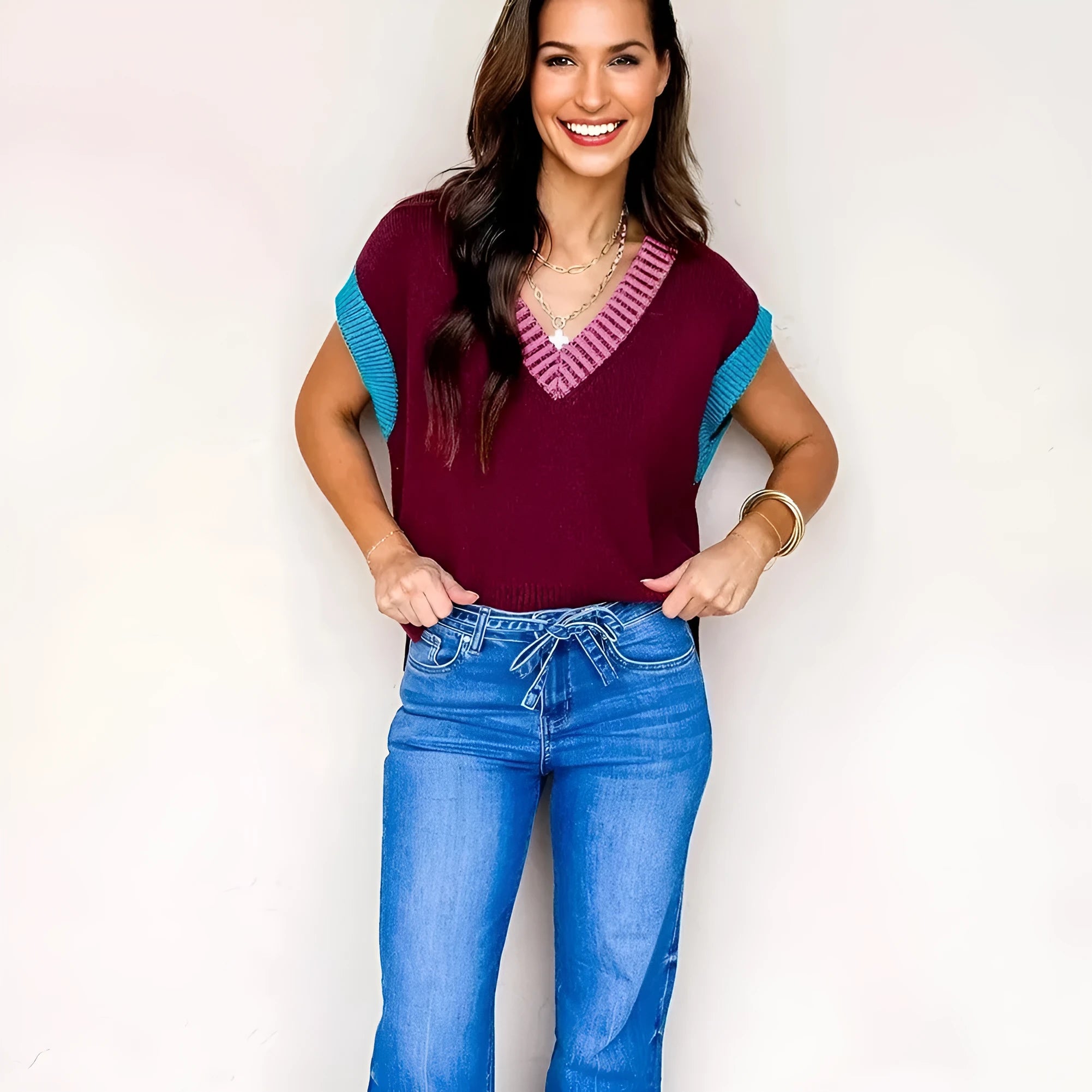 Burgundy loose-fit V-neck sweater with contrast trim on cuffed short sleeves.