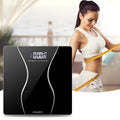 Black electronic household scale with digital display showing weight measurement up to 180kg capacity