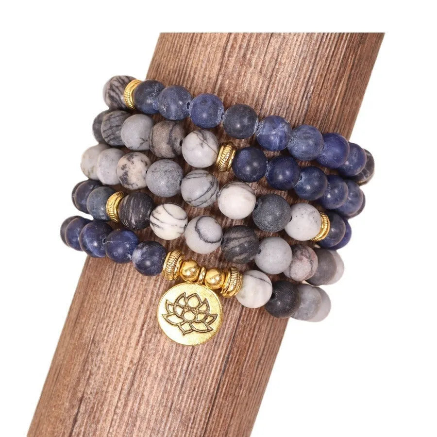 Blue multi-layer alloy bracelet with patterned network stone beads.