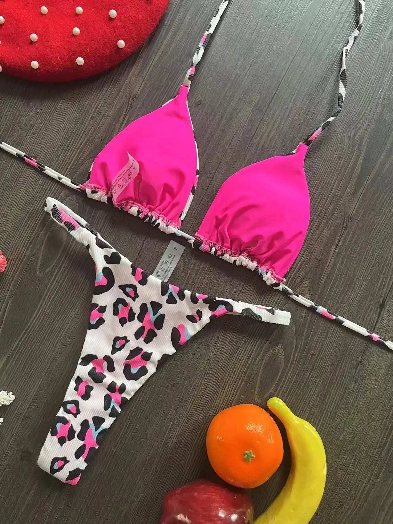 Women's briefs-style bikini swimsuit in a printed pattern, made from nylon with a cotton lining.