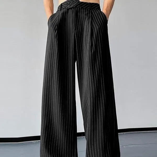 Men's black vertical striped pleated casual trousers laid flat.