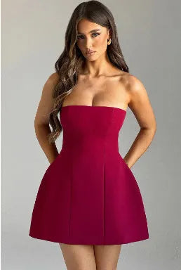 Women's solid colour backless tube dress with A-line short skirt on a hanger.