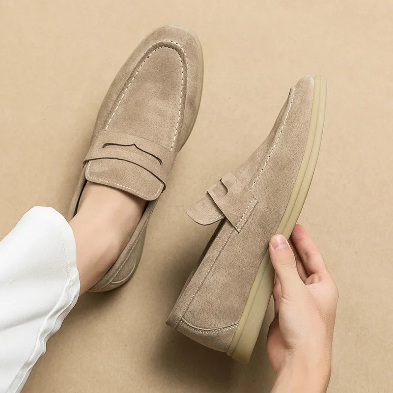 Men's beige slip-on leather casual shoes with a round toe and mid-height rubber sole.