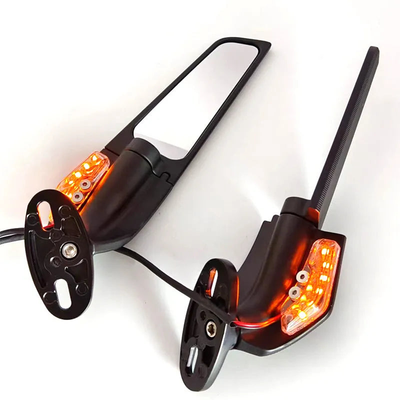 Pair of aluminium alloy motorcycle rearview mirror reflectors with convex glass lens and yellow LED light.