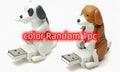 USB dancing dog toy in random colour made from ABS plastic on a desk