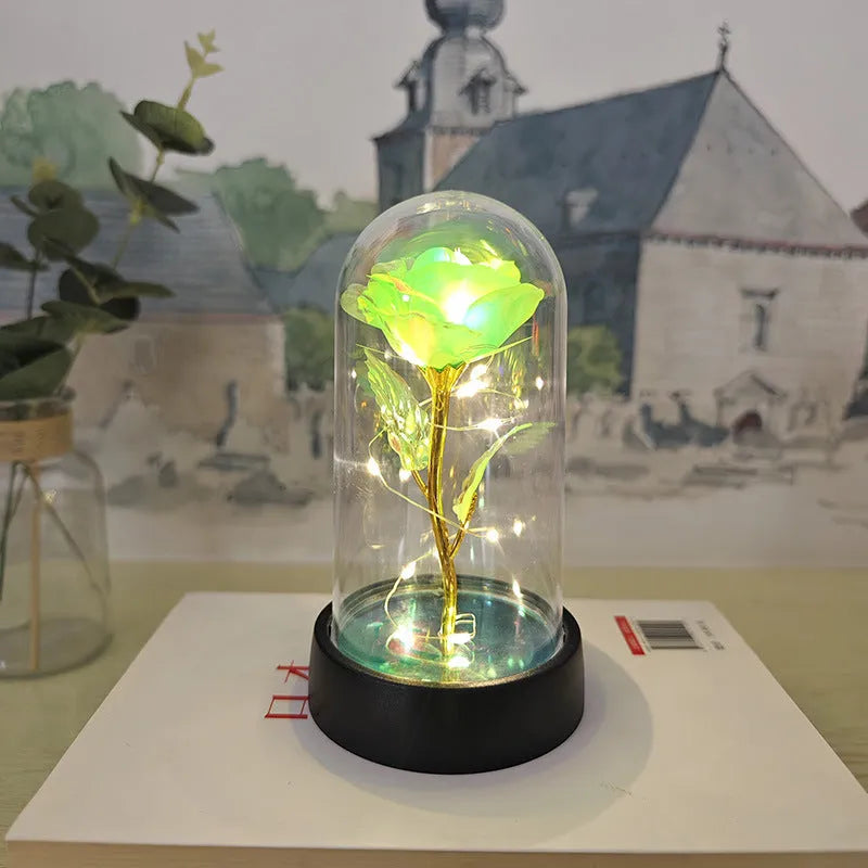 Glass cover small night lamp with plastic flowers in 15cm tall design with black base