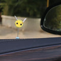 Small yellow and black fur ball bee car ornament with adhesive backing.
