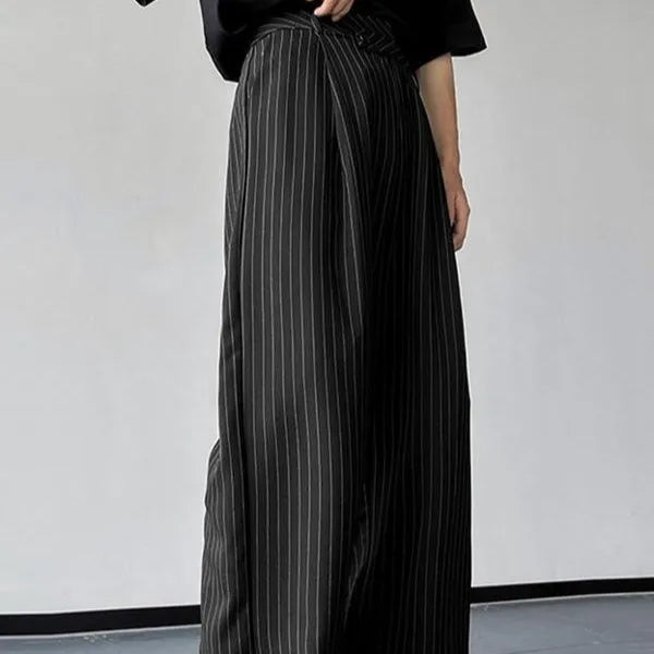 Men's black vertical striped pleated casual trousers laid flat.