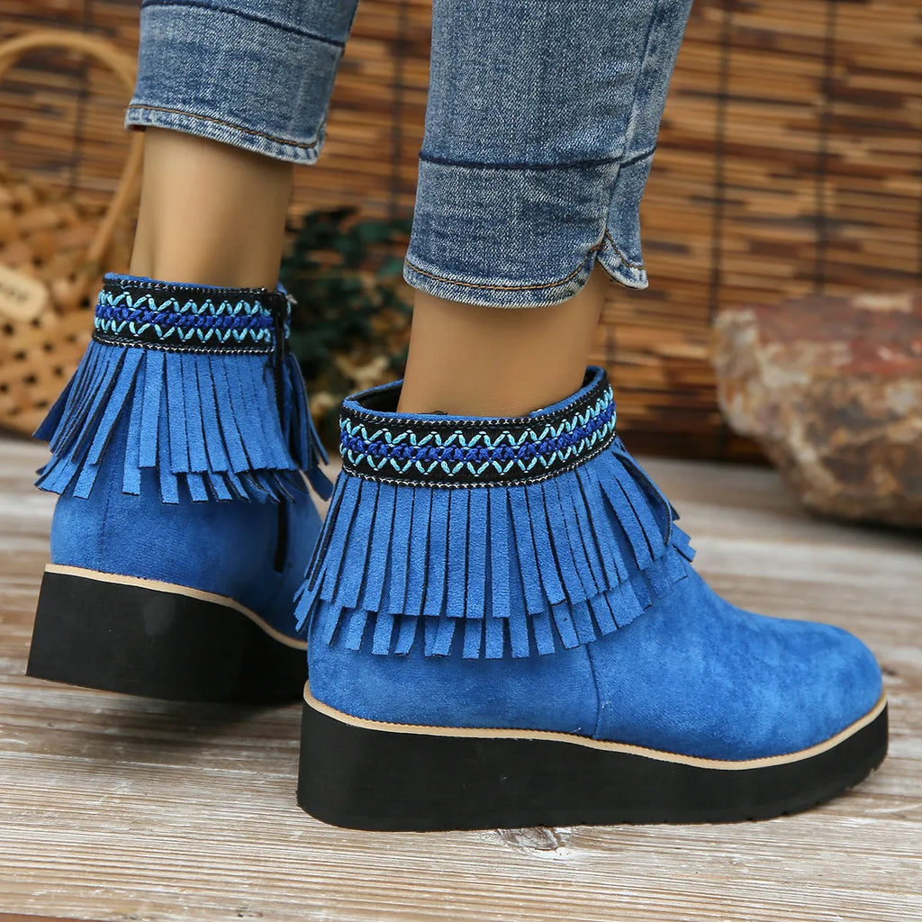 Women's dark brown suede wedge ankle boots with a side zip and decorative tassel.