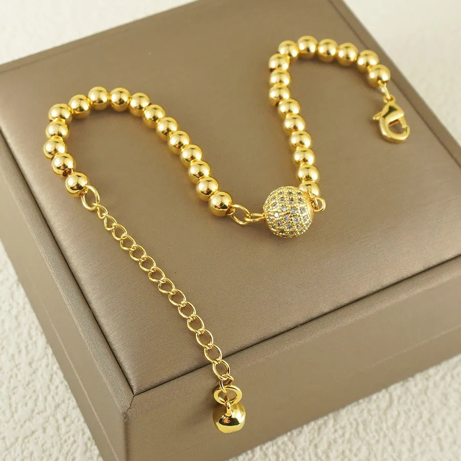 Women's copper bracelet with zircon Arabic styling and heart-shaped pendant on wrist