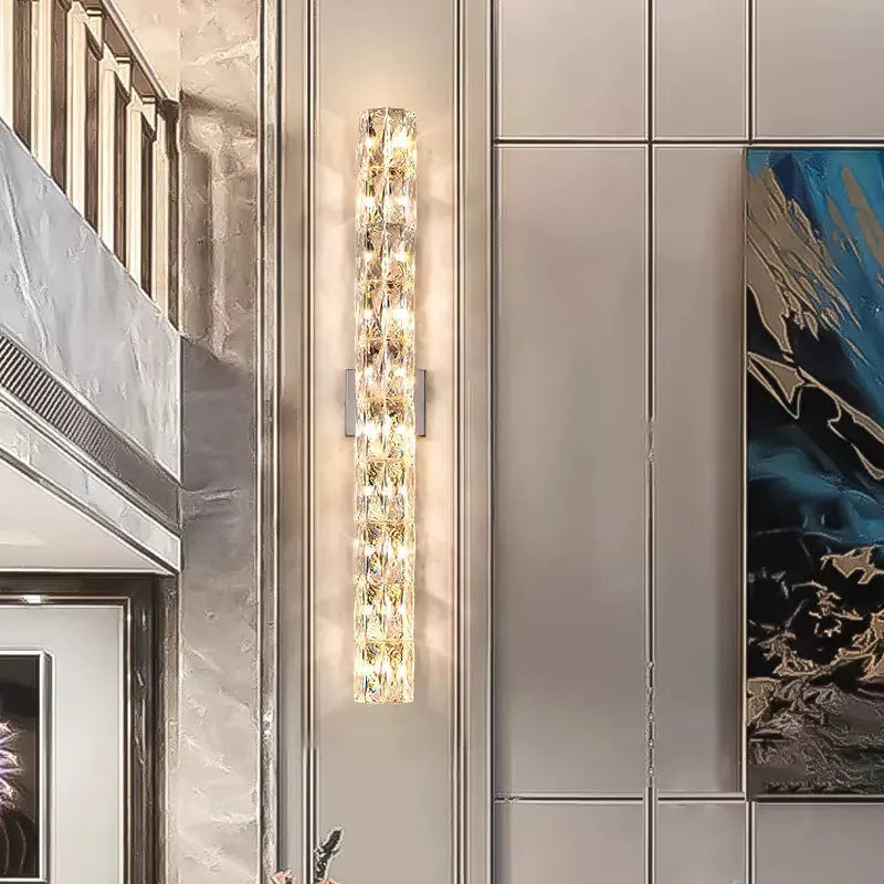 Crystal shade LED wall lamp in chrome or gold finish on stainless steel base.