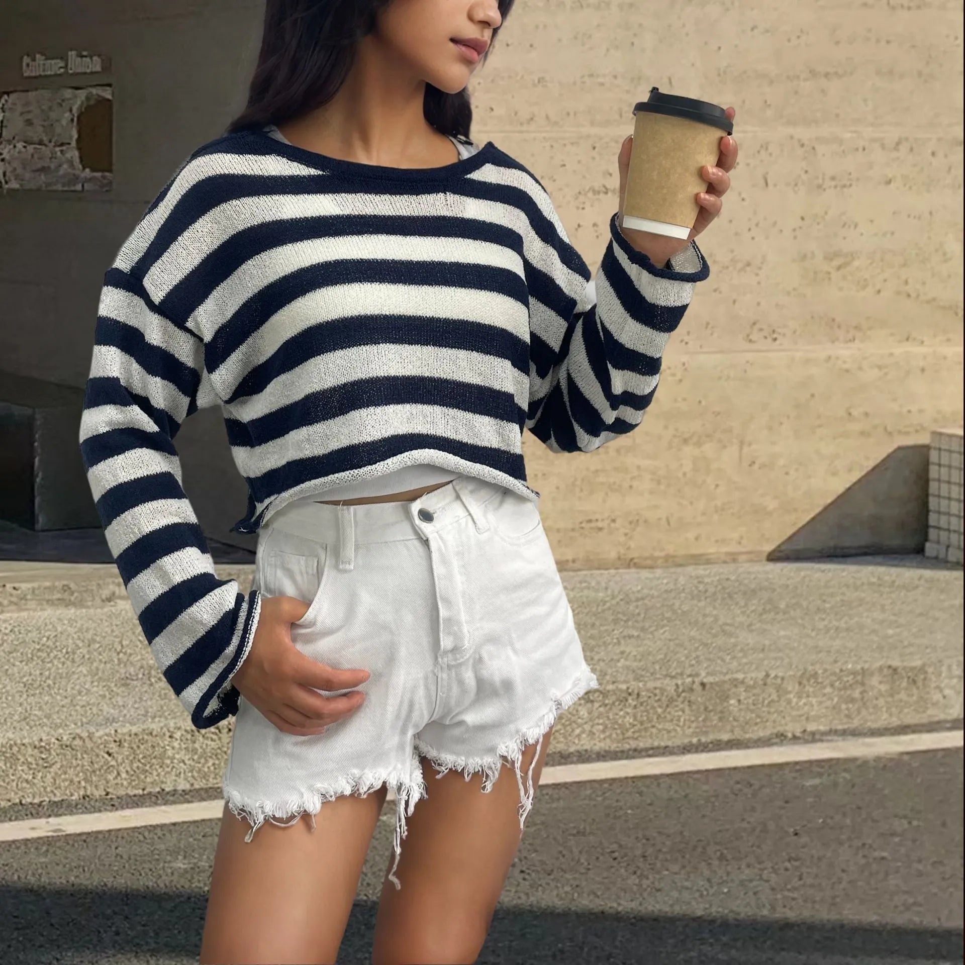 Striped long-sleeved pullover sweater in mercerised cotton, shown in blue with an exposed navel design.