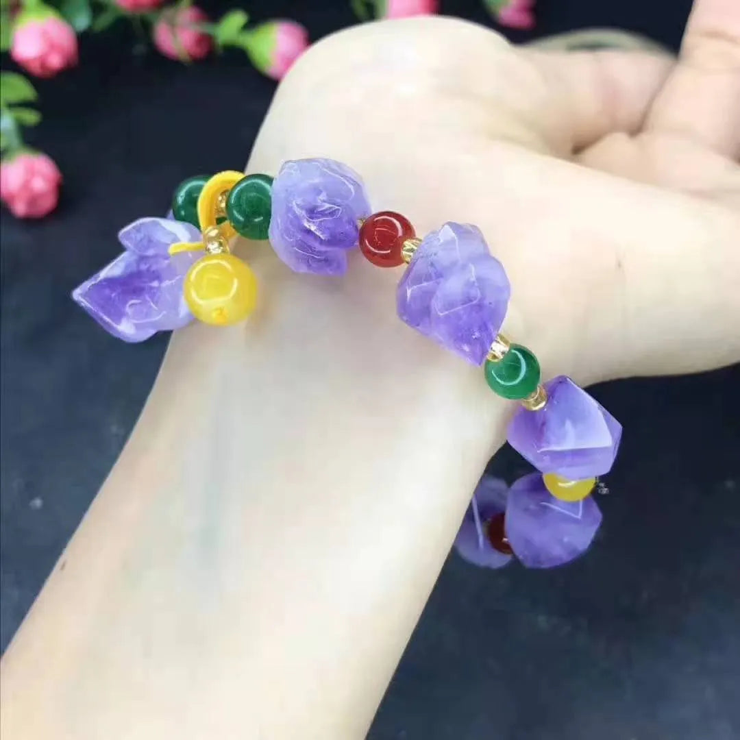 Purple natural shaped amethyst bead bracelet for women with a fu character charm.